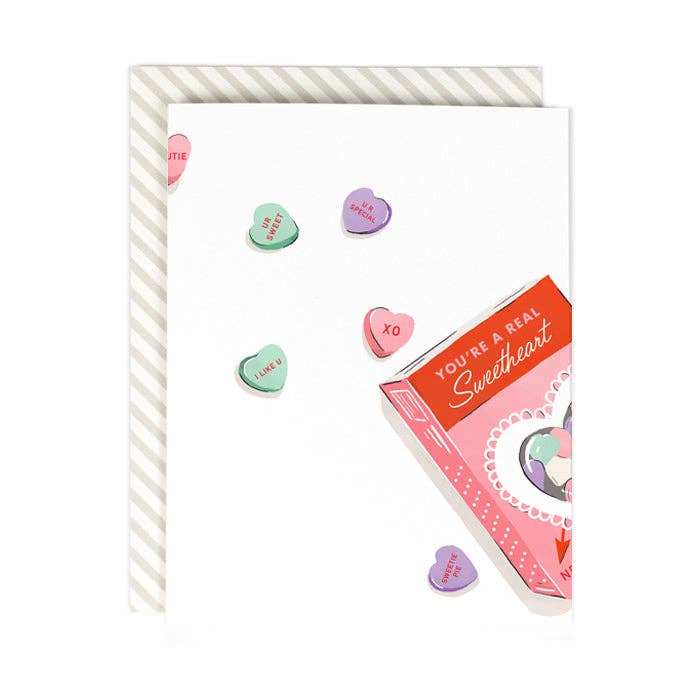 Greeting card with candy hearts, titled 'A Real Sweetheart', featuring warm white cover, includes envelope and sleeve, made in USA.