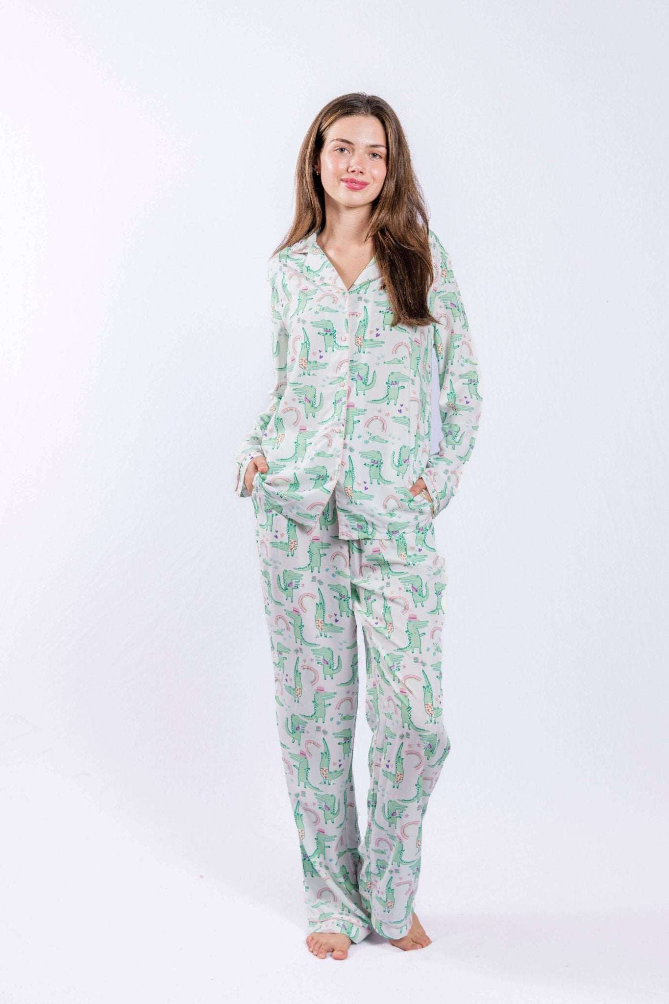 Alligator print pajama set with button-down shirt and pants, featuring tassel detail and contrast piping.