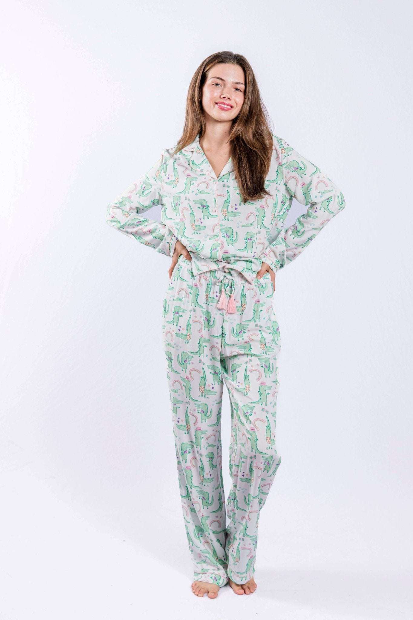 Alligator print pajama set with button-down shirt and pants, featuring contrast piping and tassel detail.