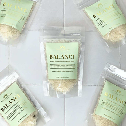 Himalayan bath salts with geranium, grapefruit, chamomile in green gold packaging.