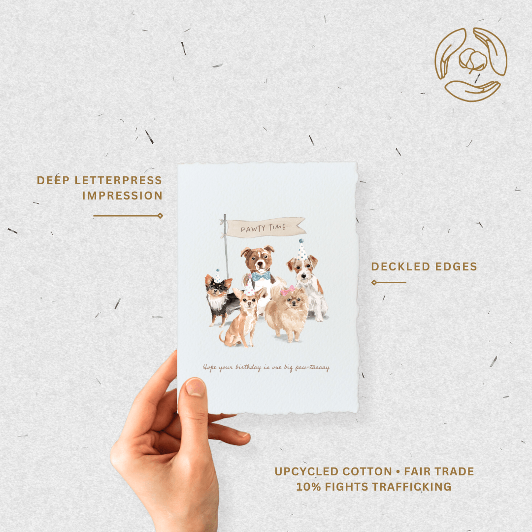 Eco-friendly greeting card featuring playful dogs, handmade with deckled edges and gold ink, celebrating birthdays with a "paw-tay" theme.