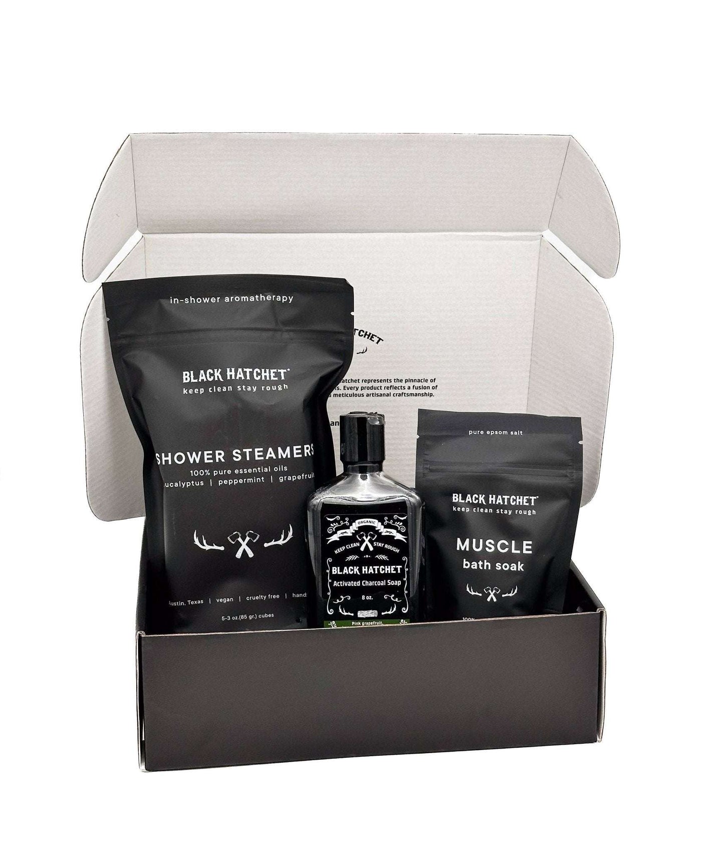 Black Hatchet Gift Set in open box with shower steamers, body wash, and muscle soak.