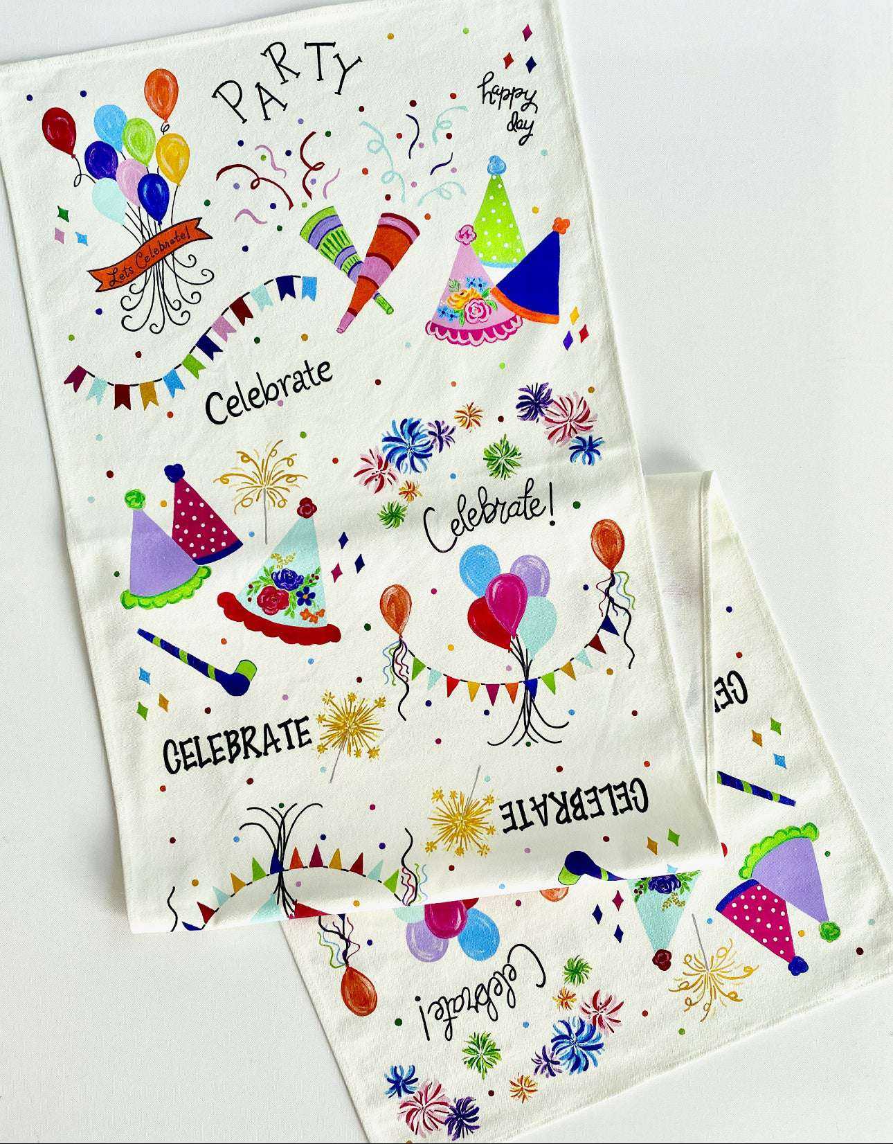 Celebration Box with festive cotton canvas table runner featuring colorful party decorations.