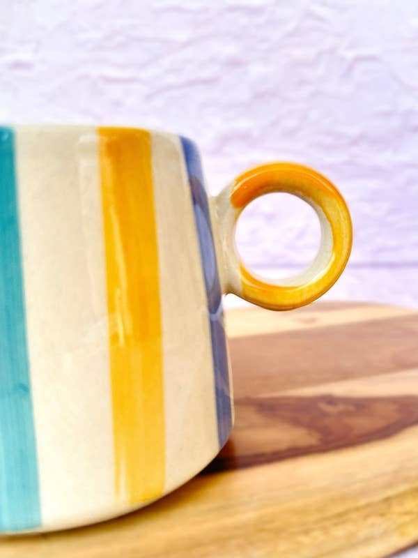 Casa Amarosa ceramic bright striped coffee mug with ergonomic handle, 450ml capacity.