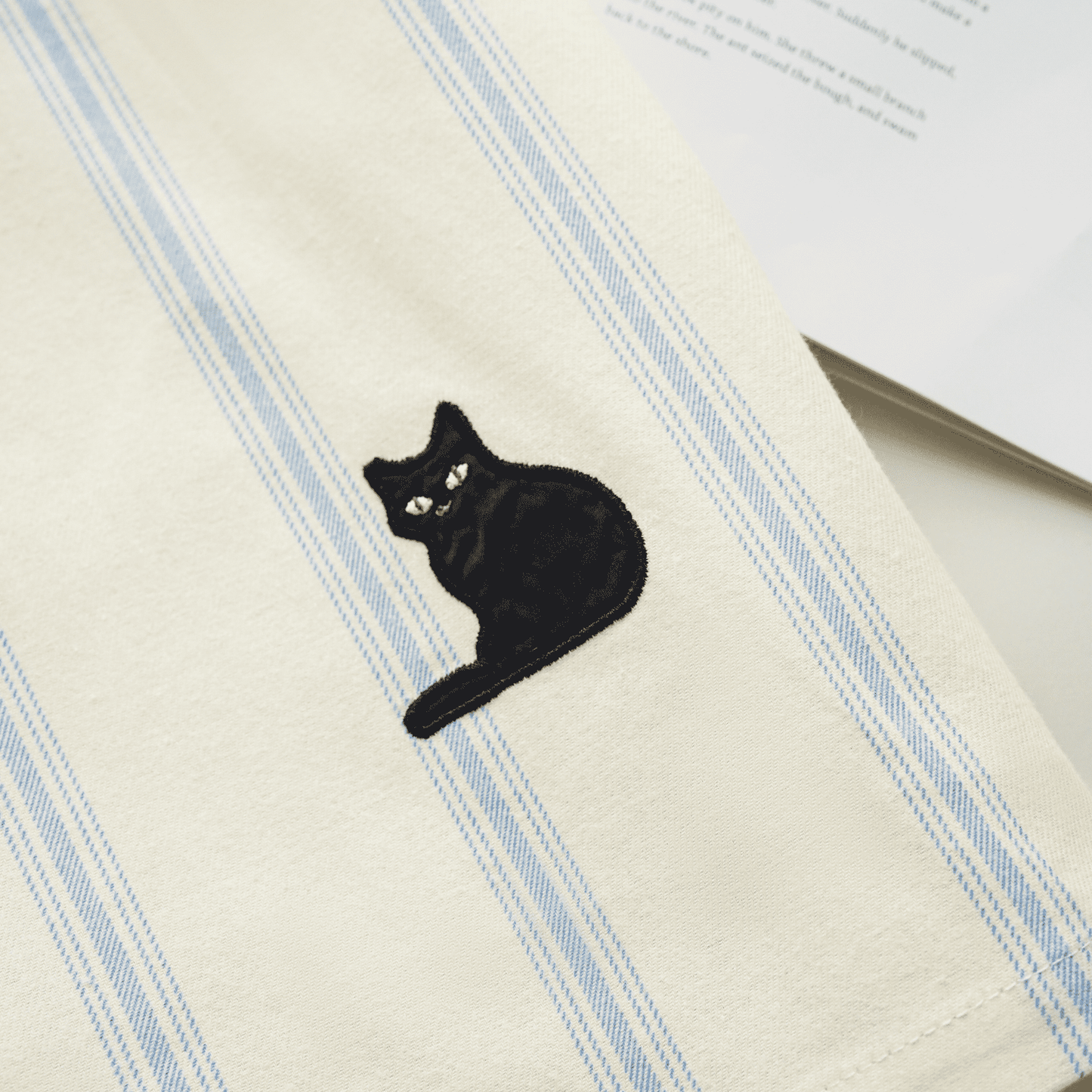 Cotton striped loungewear set with blue stripes and embroidered cat detail.