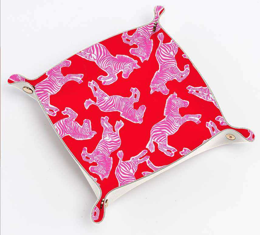 Pink and red zebra print leather trinket tray with gold snaps.