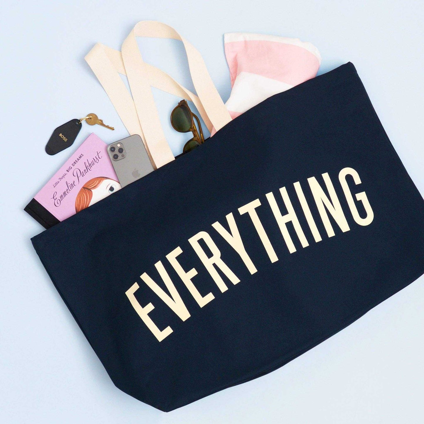 Midnight Blue REALLY Big Bag with ivory handles and "EVERYTHING" text, showcasing spacious capacity and assorted items inside.