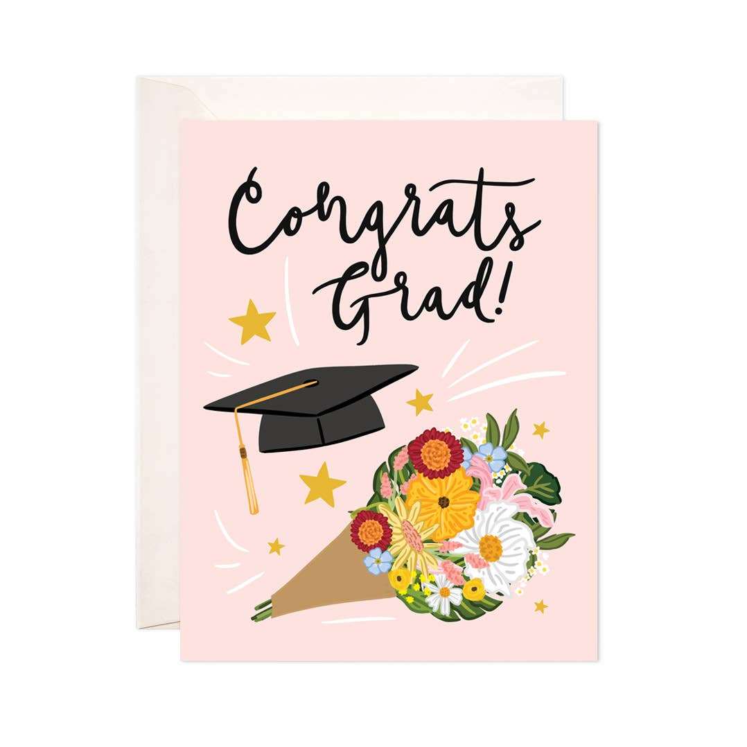 Graduation greeting card with floral bouquet and cap design.