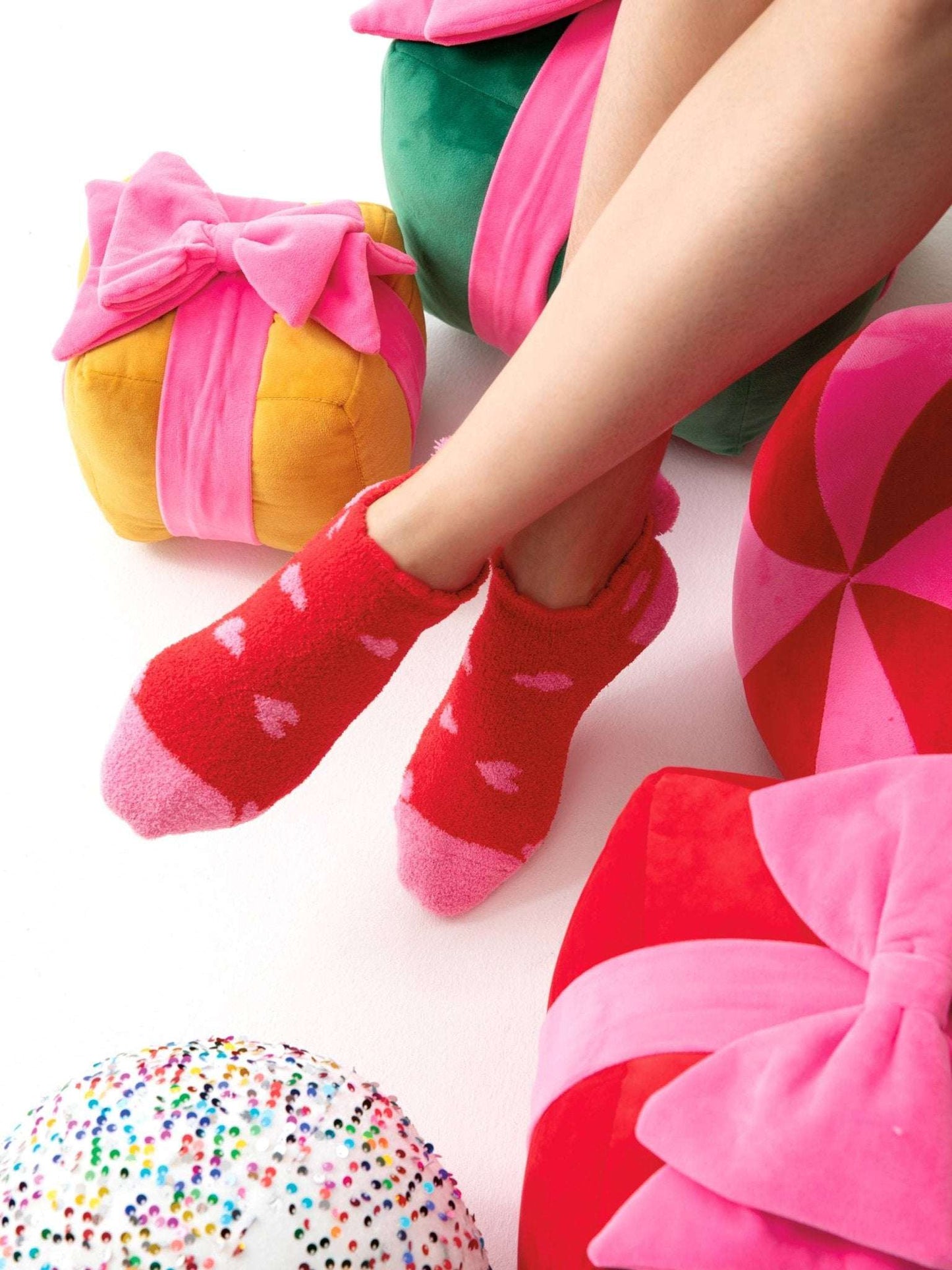 HEARTS HOME SOCKS in red with heart pattern and rubber grip bottom.