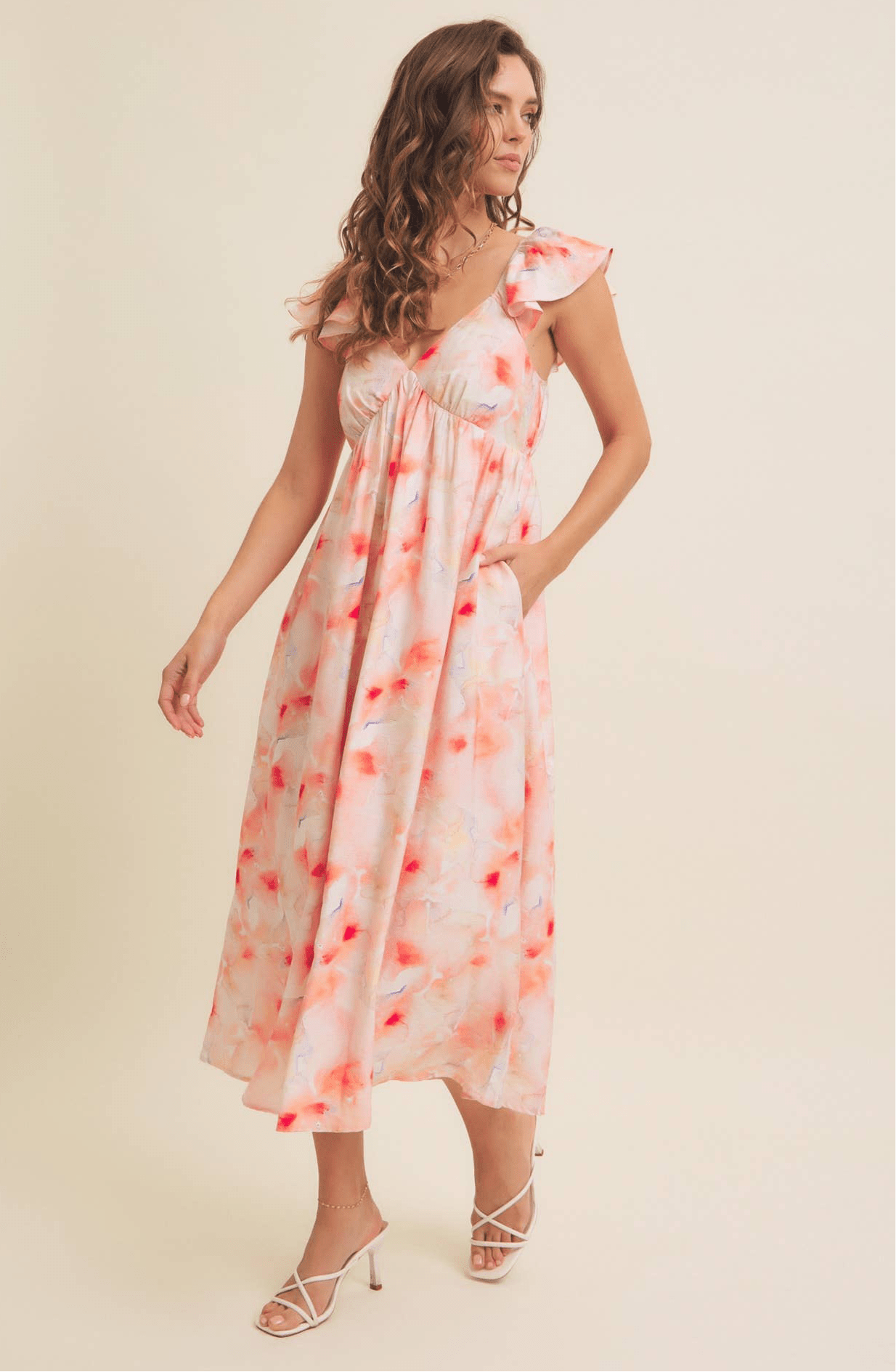 Watercolor floral print midi dress with flutter sleeves and elastic waist.