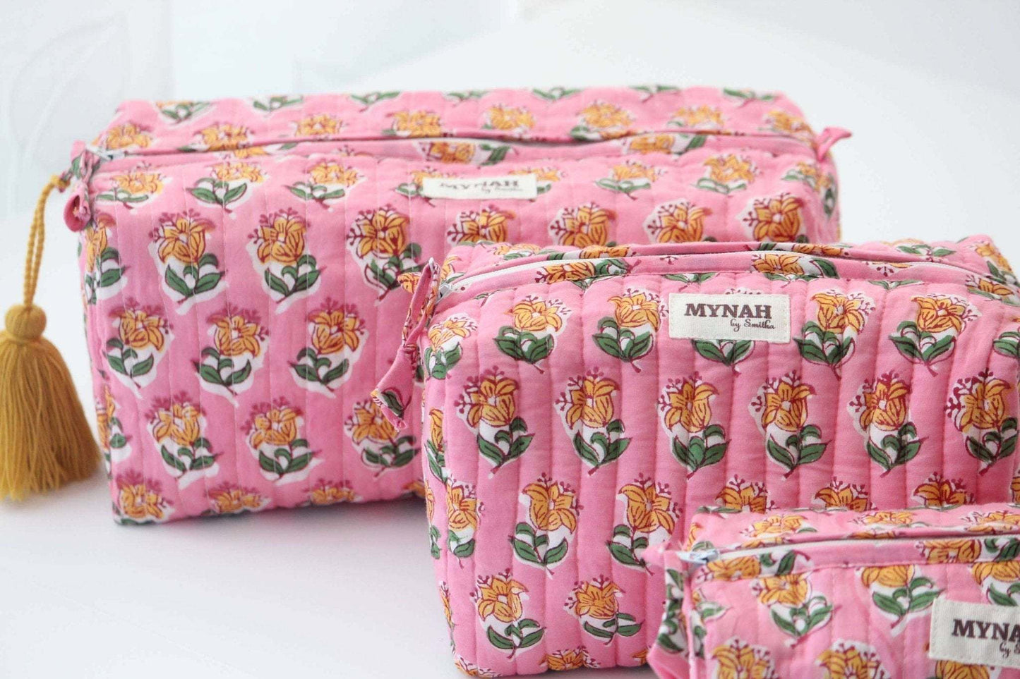 Large Bubblegum Mot Print Bag with floral design and waterproof lining.