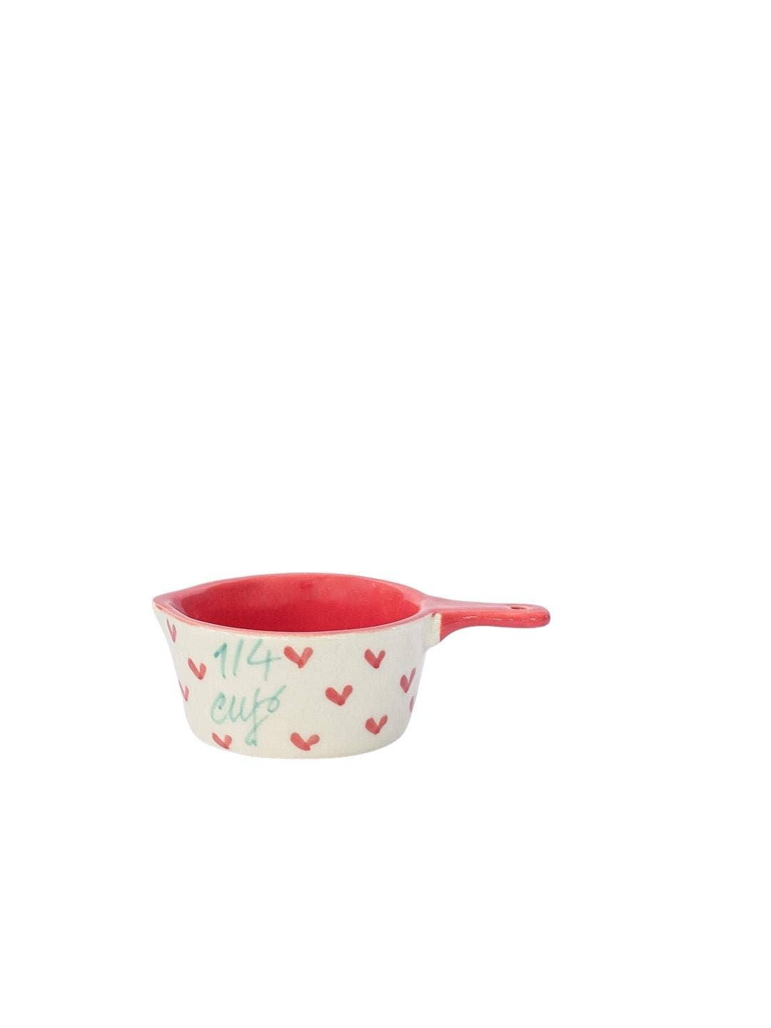 Handpainted ceramic measuring cup with red heart design, part of a set of four sizes, from Casaamarosa.