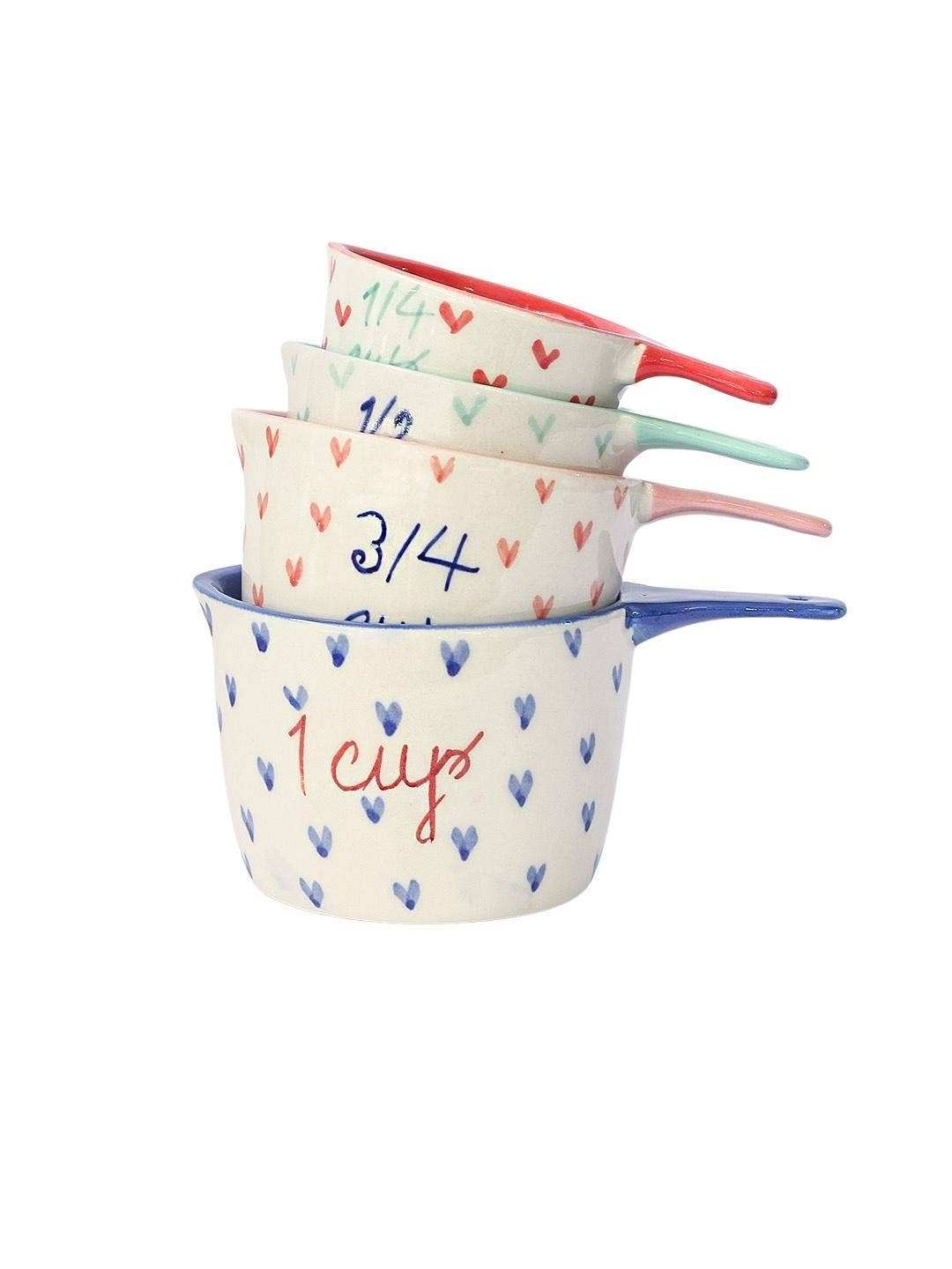 Little Hearts Measuring Ceramic Cup set of 4 with whimsical heart designs, handpainted and durable.