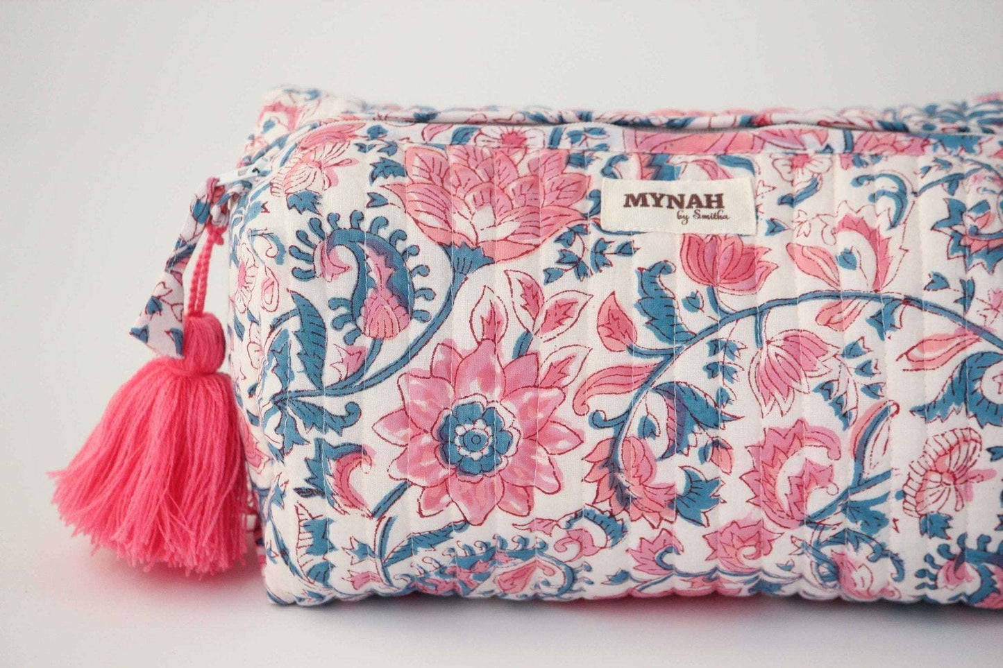 Lotus blooms floral quilted travel bag with waterproof lining and hand block print.