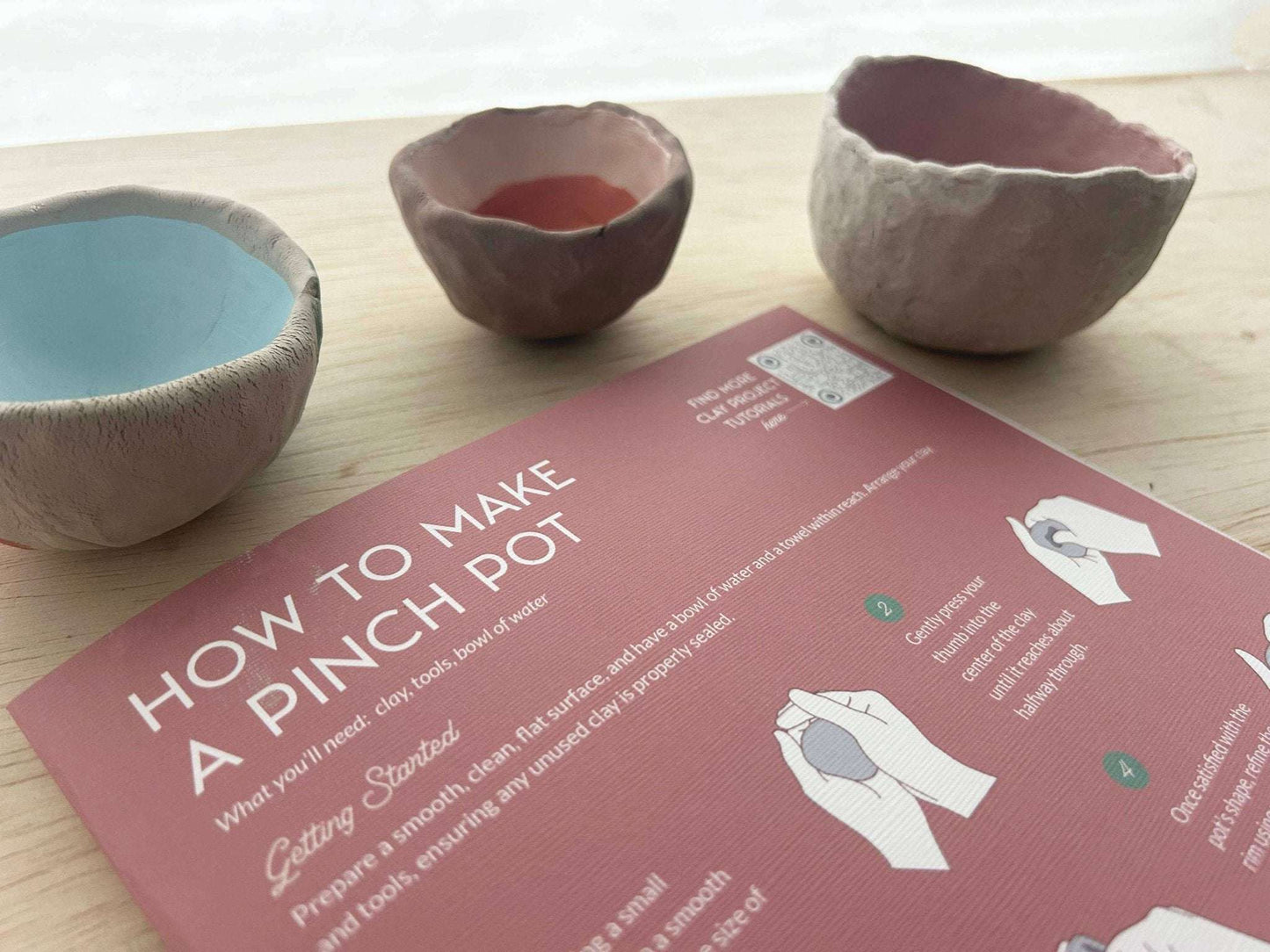 Meditative Art Clay Kit with clay pinch pots and instruction card.