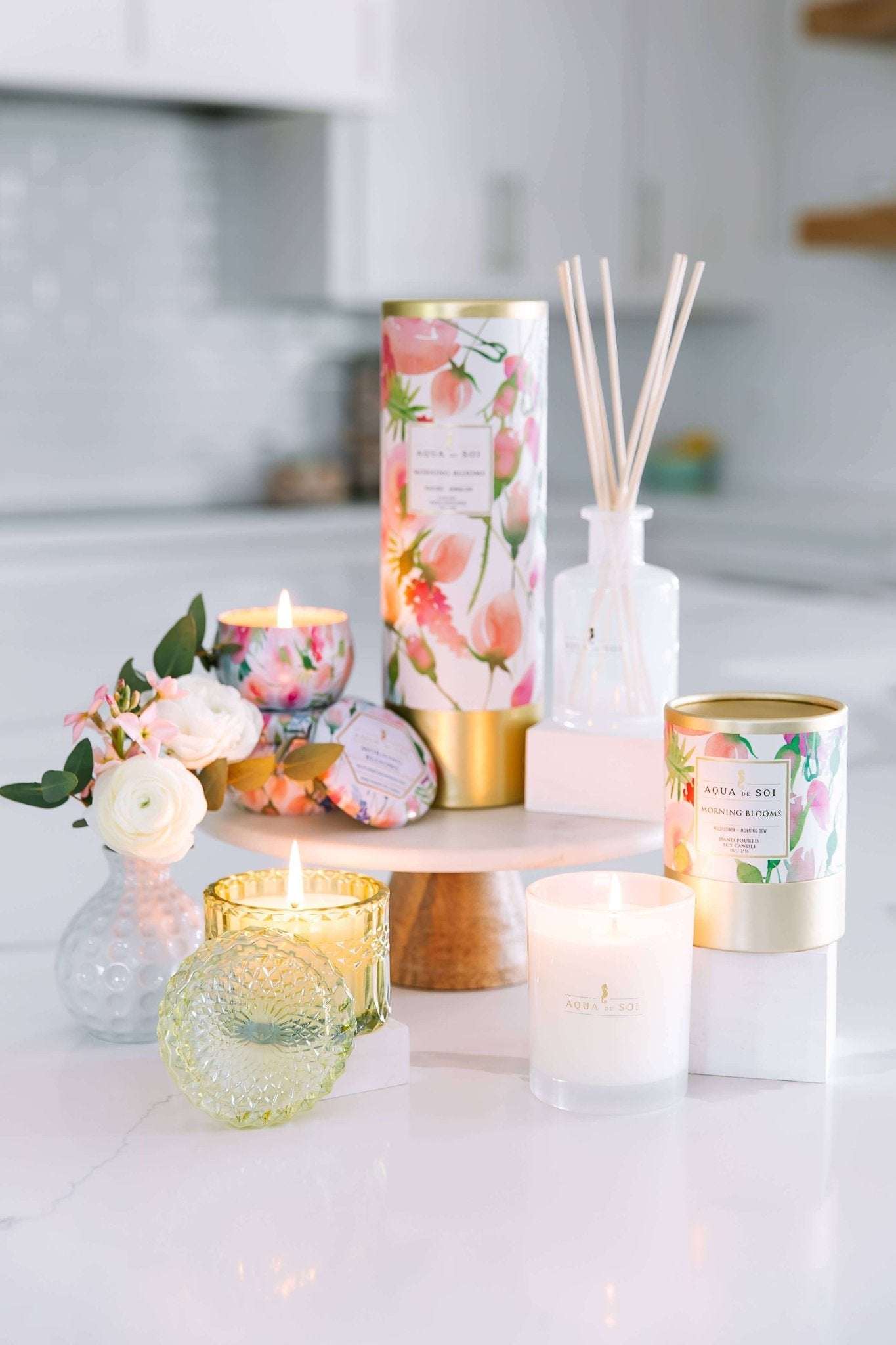 Morning Bloom 8oz Petite Shimmer in vibrant green on a stylish white surface with candles and floral decor.