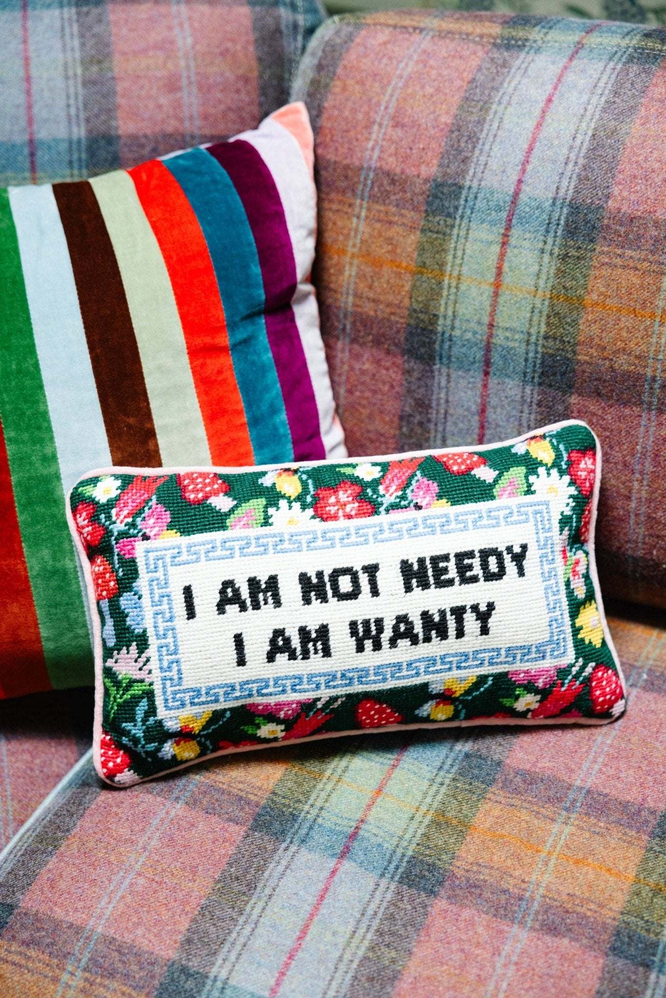 Chic needlepoint pillow with "Not Needy" quote, floral design, and pink velvet backing.