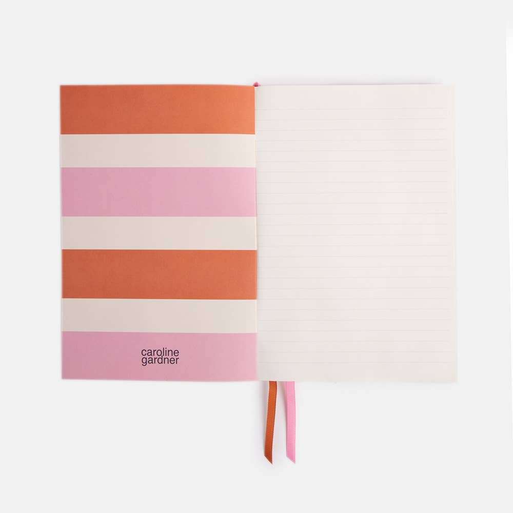 Pale Pink Dotty A5 Notebook with pink multi-spot print, ruled pages, and elastic closure.