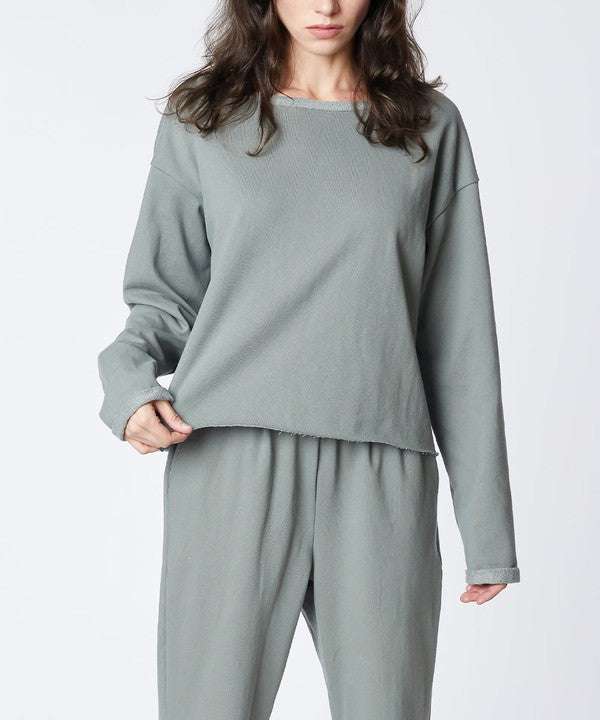 Recycled cotton lounge set in gray with loose fit and reverse stitch accents.