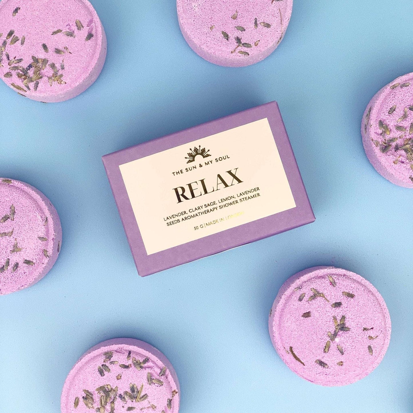 Relax Aromatherapy Shower Steamer with Lavender and Clary Sage scent in a gift box, featuring gold foil label and natural ingredients.