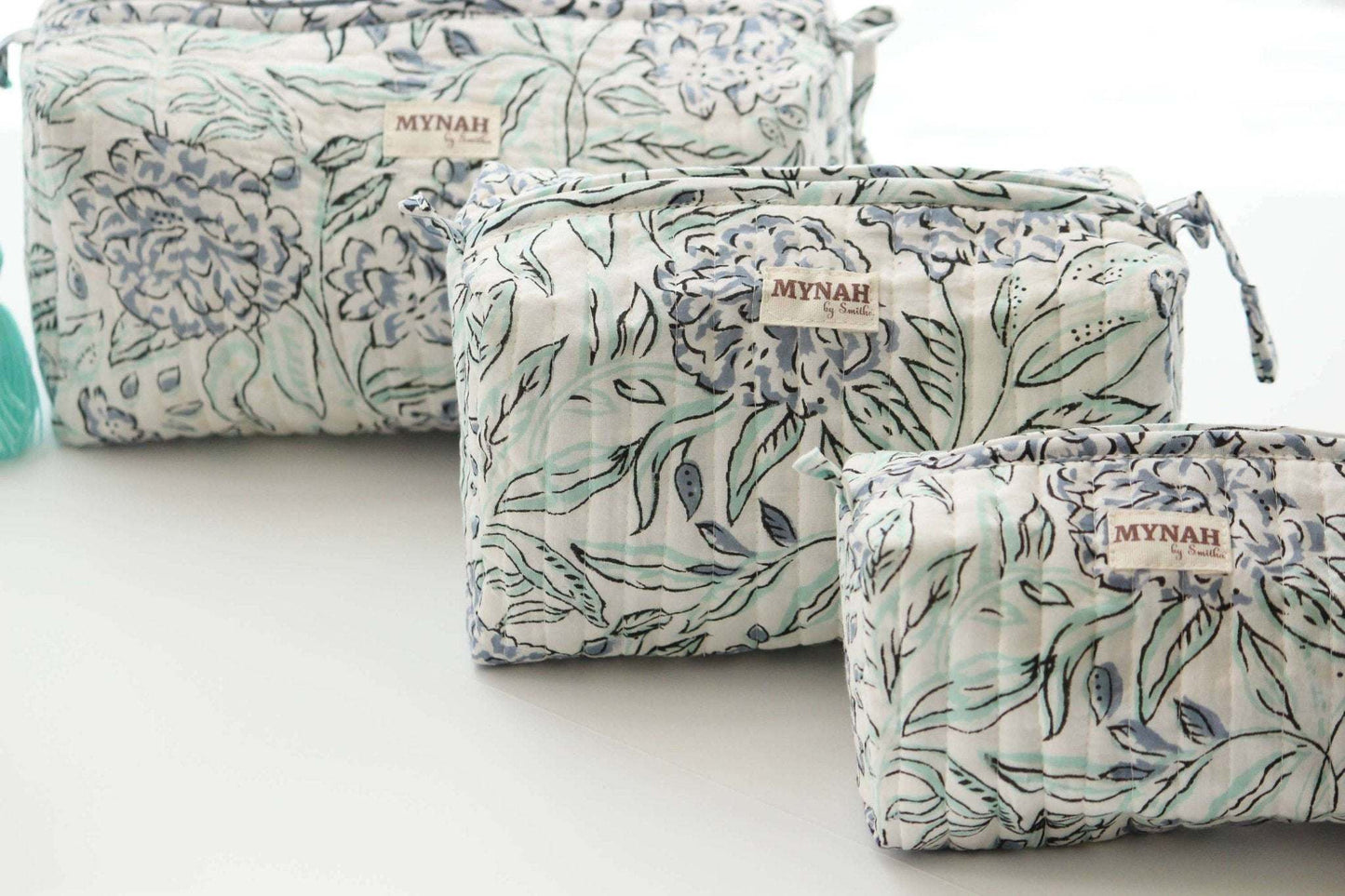 Set of 3 handmade hydrangea motif quilted travel bags with waterproof lining.