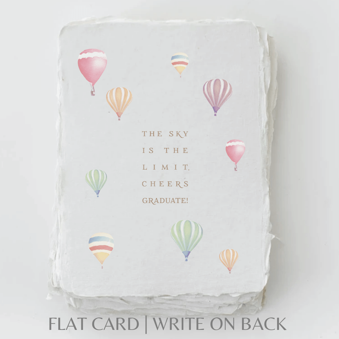 Handmade graduation card with "Sky is the limit" in gold ink, featuring colorful balloons, deckled edge paper.