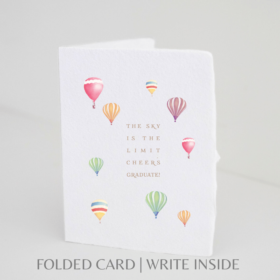Handmade graduation card with "Sky is the limit" message, featuring colorful balloons.
