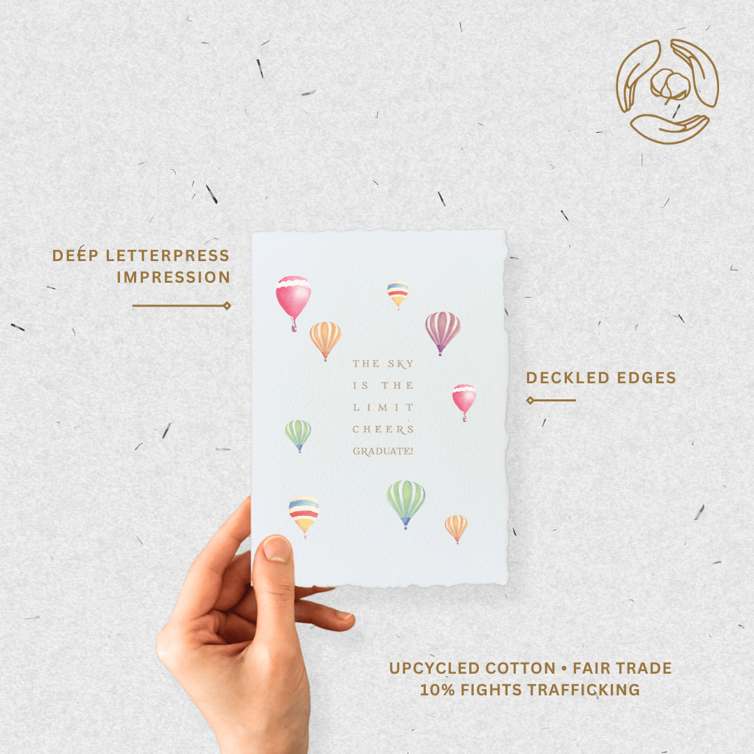 Handmade graduation card with "Sky is the limit" message, deckled edges, and gold letterpress on white paper.