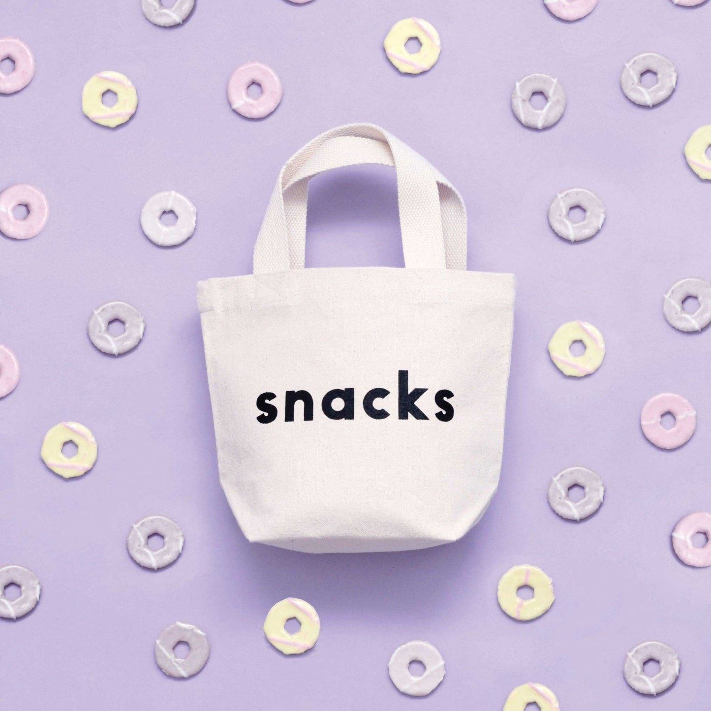 Little canvas bag for snacks with black print on natural fabric.