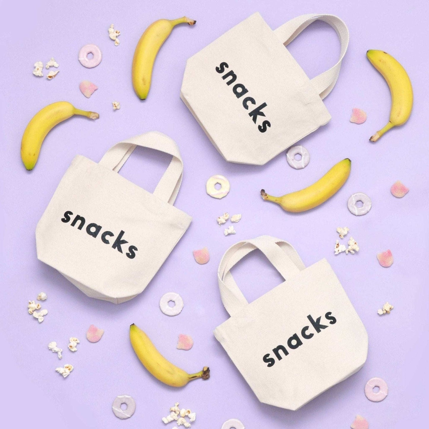 Little canvas snack bags with black screen print, perfect for kids.