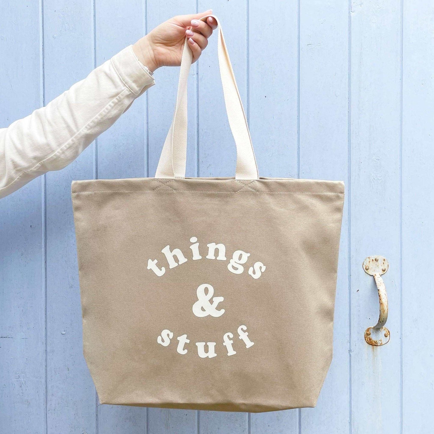 Stone canvas tote bag with "Things & Stuff" design in off-white, ideal for daily use.