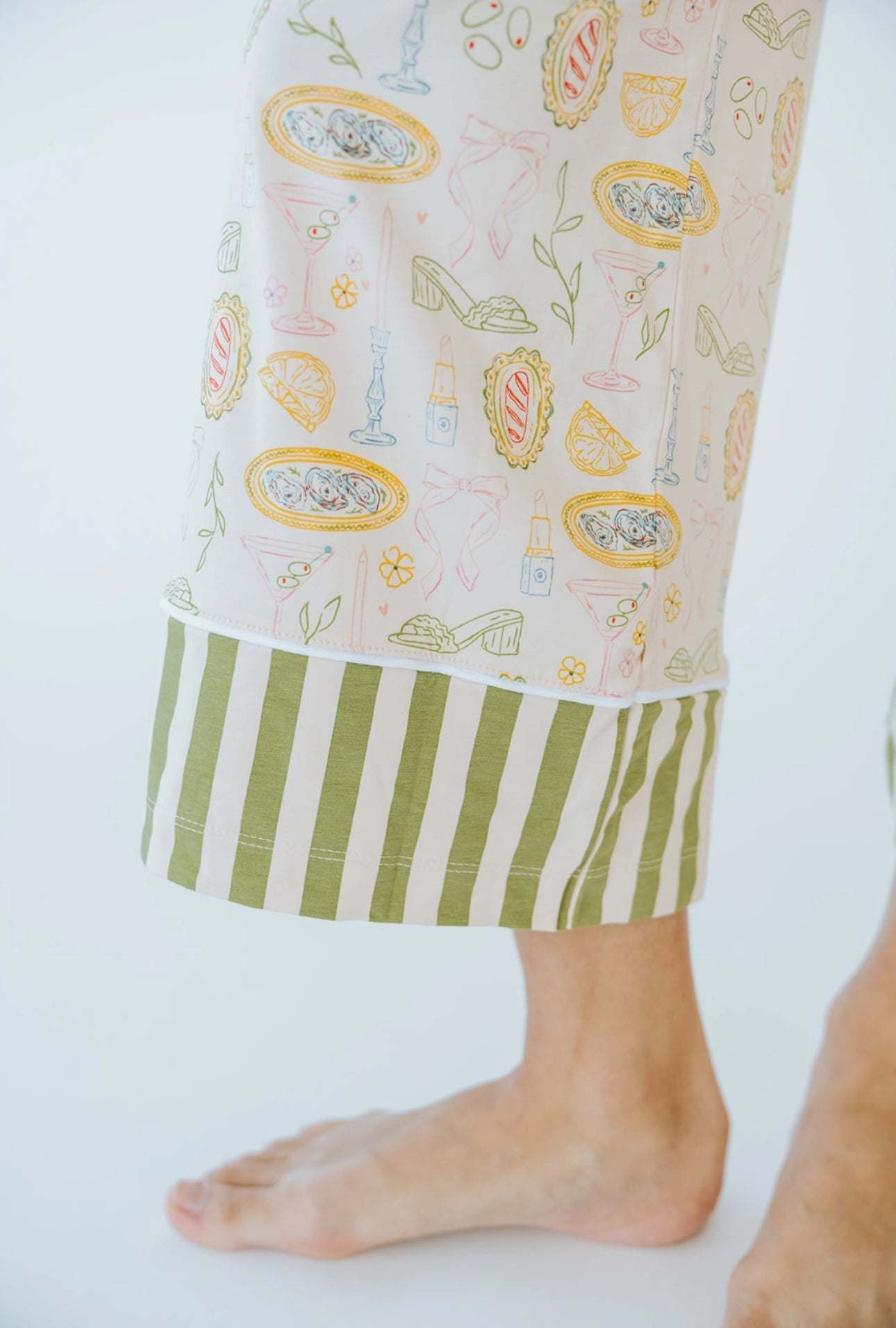 Tini Jammies martini-inspired sleepwear set with wide leg cropped pant and bow tie shoulder strap, featuring whimsical patterns.