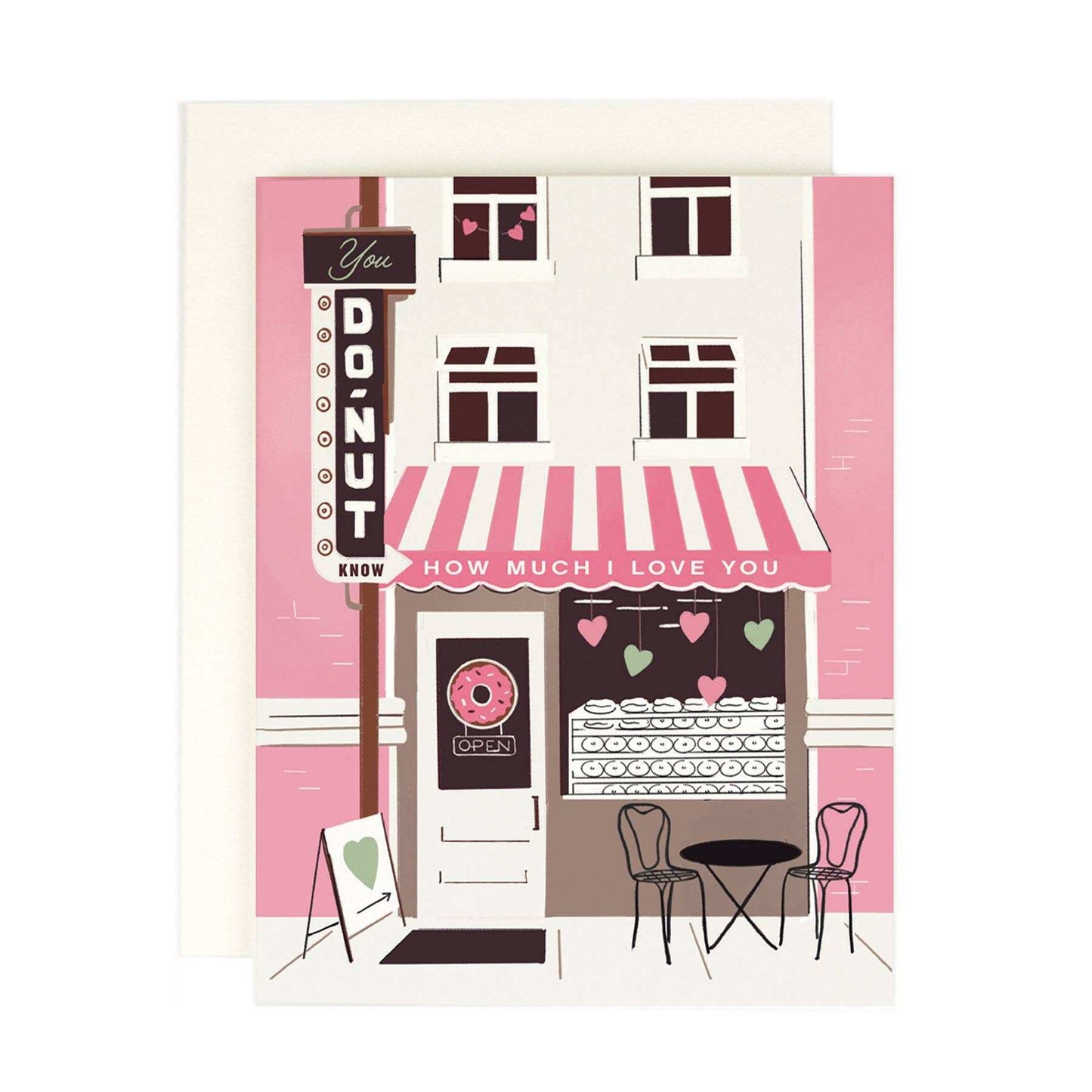 Illustrated "You Donut Know" greeting card with pink bakery design, warm white cover, and envelope.