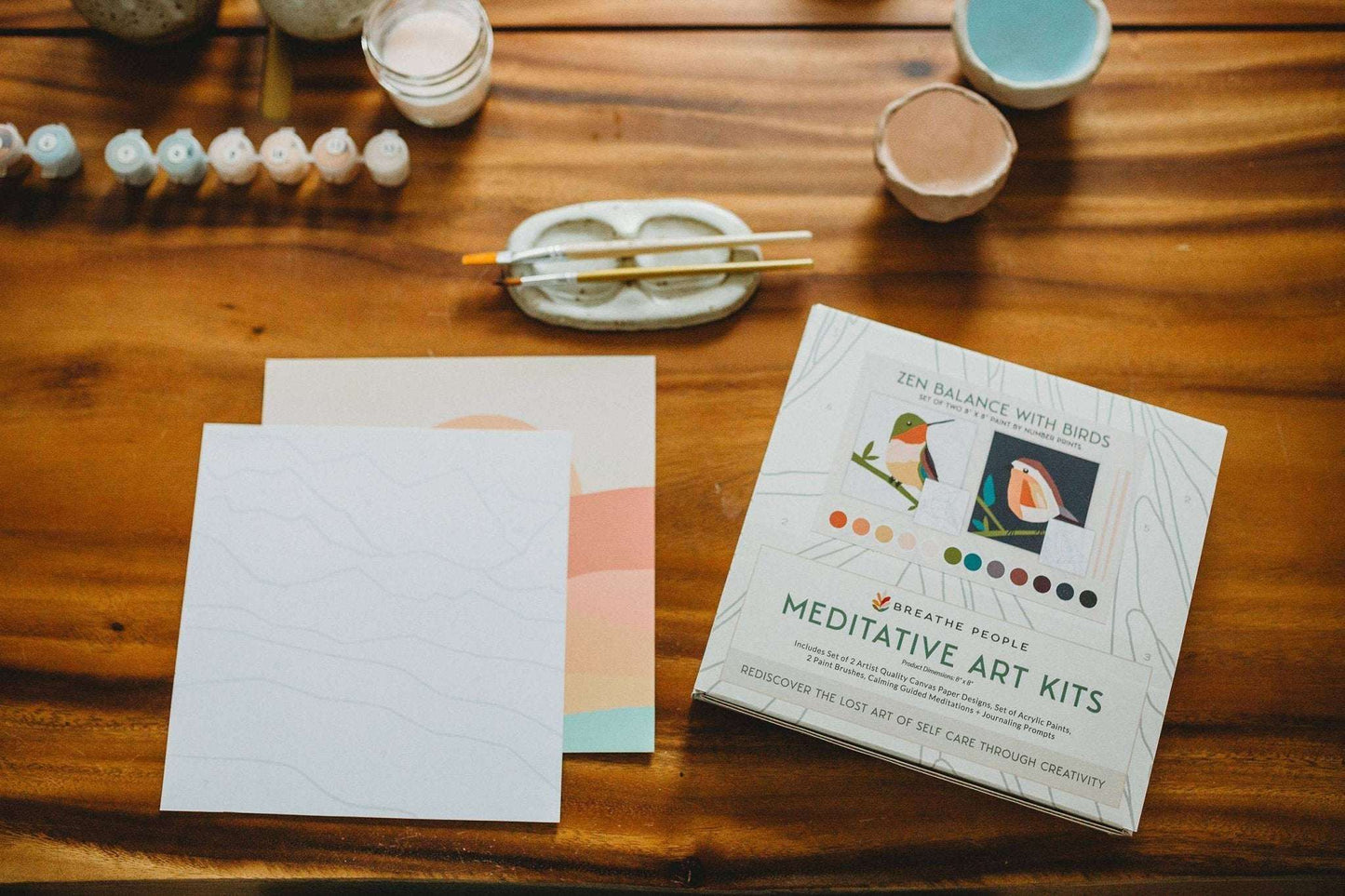 Zen Balance with Birds Meditative Art Paint by Number Kit featuring canvas prints and paints on wooden table.