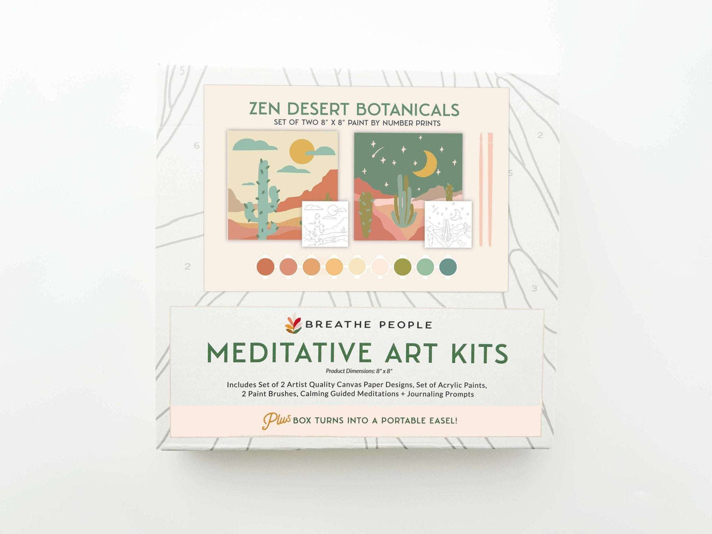 Zen Desert Meditative Art Paint by Number Kit with Easel in gift box packaging, includes canvas prints, paint brushes, acrylic paints, guided meditations, and journaling prompts.