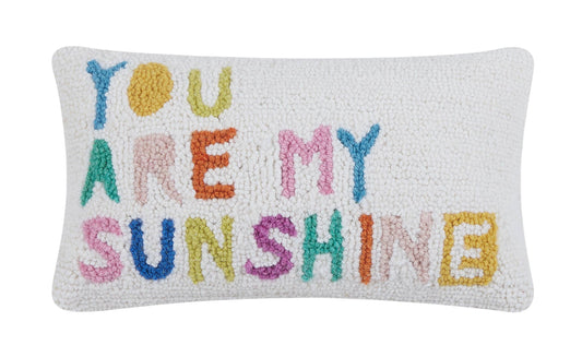 Decorative pillow with 'You Are My Sunshine' text in colorful letters on a white background