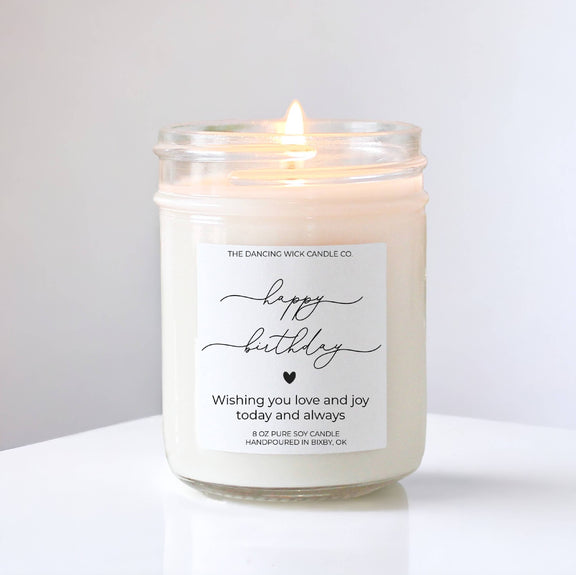 Happy Birthday Gift Candle in a glass jar with burning wick, featuring birthday cake scent.