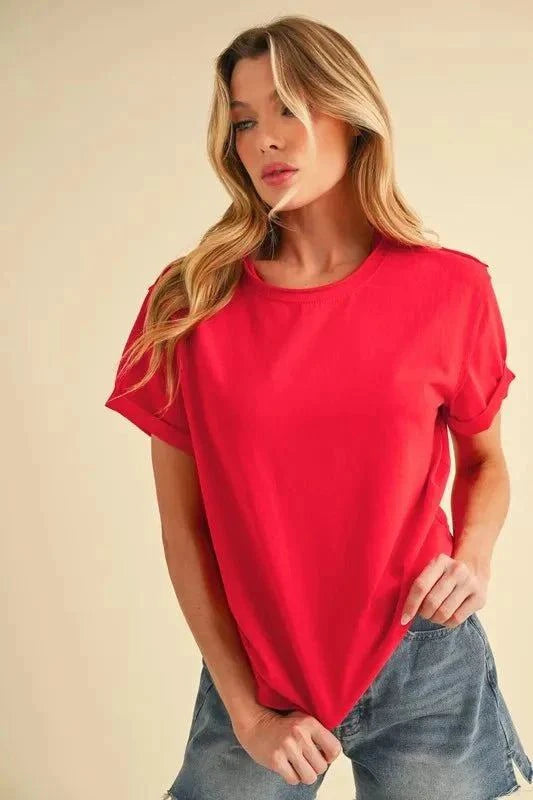 Aemi + Co Exposed Seam Round Neck Short Sleeve T-Shirt in red, featuring visible stitching and casual style.