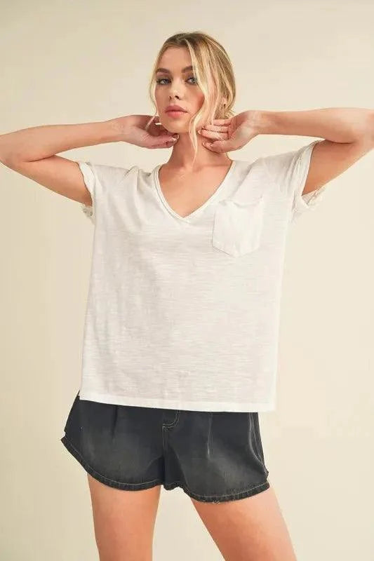 Aemi + Co Side Slit V-Neck Short Rolled Sleeve T-Shirt with side slits and rolled sleeves.