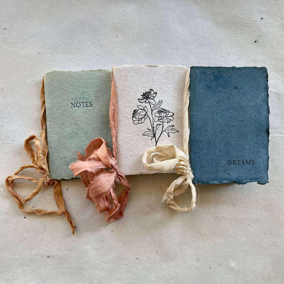 Artisan made small notebook with floral design and silk ribbon for dreams and notes.
