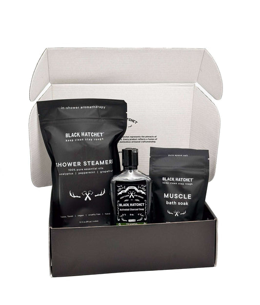 Black Hatchet Gift Set in open box with shower steamers, body wash, and muscle soak.