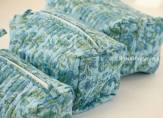 Blue green floral hand block printed quilted travel organizer bag.