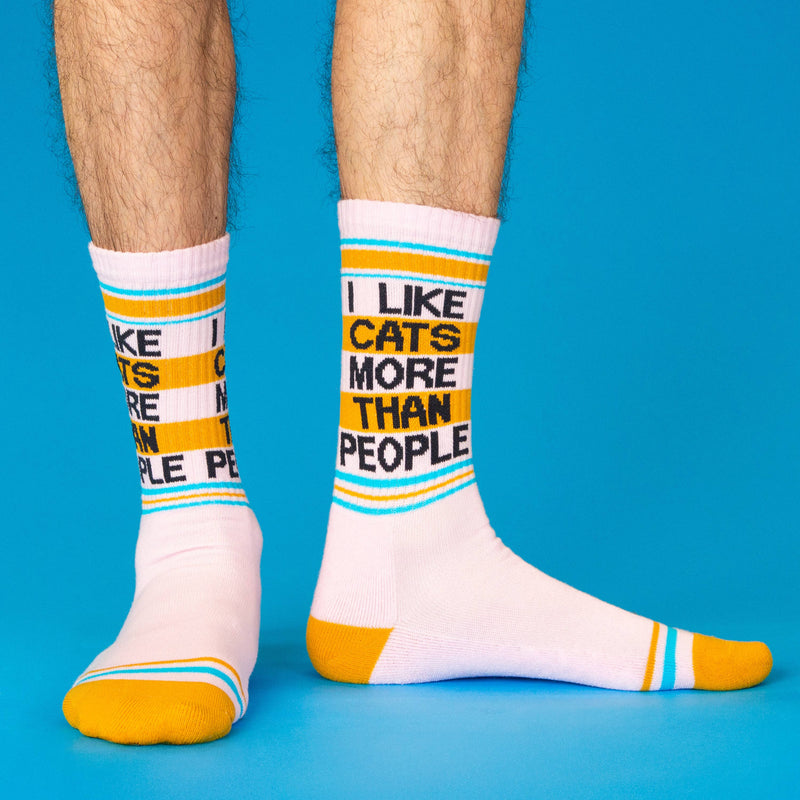 White socks with colorful text and stripes on a blue background
