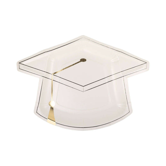 Cap shaped plate with gold foil accents for graduation party.