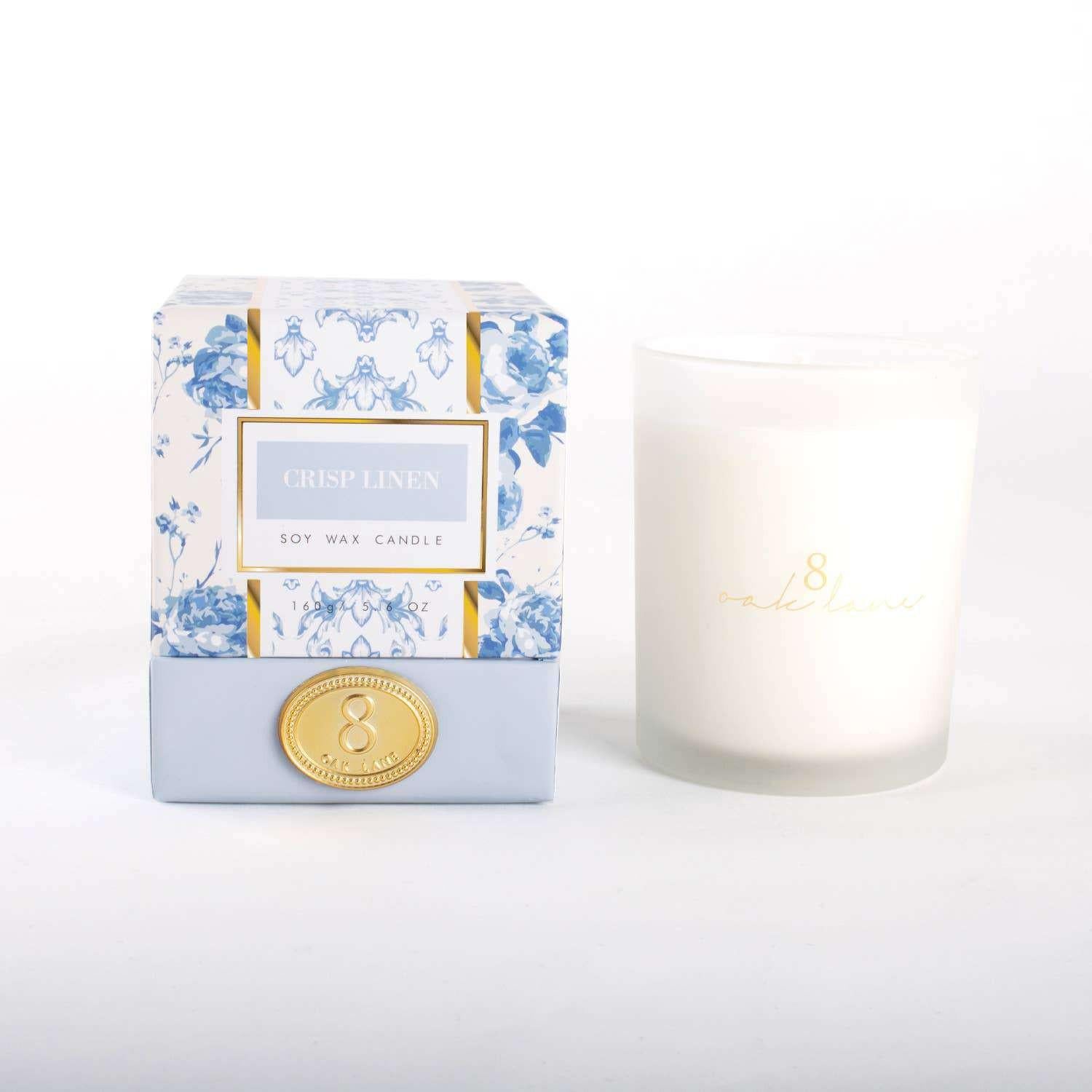 Crisp Linen fragrance 5.6oz soy wax candle in frosted glass with floral packaging.