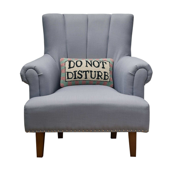 Do Not Disturb Hook Pillow on grey armchair with wool and velvet finish