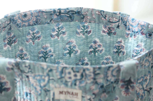 Dusty blue floral print reversible tote bag, small laptop size, quilted design.