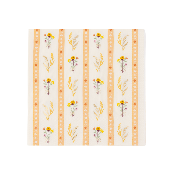 A square paper napkin featuring a vertical striped botanical pattern with yellow flowers, green leaves, and orange decorative borders on a cream background.