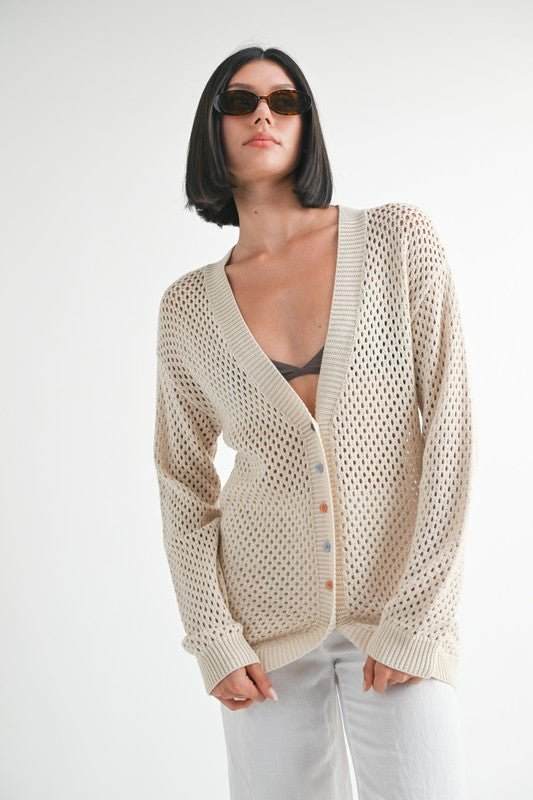 Emory Park button up crochet cardigan in beige worn by model.