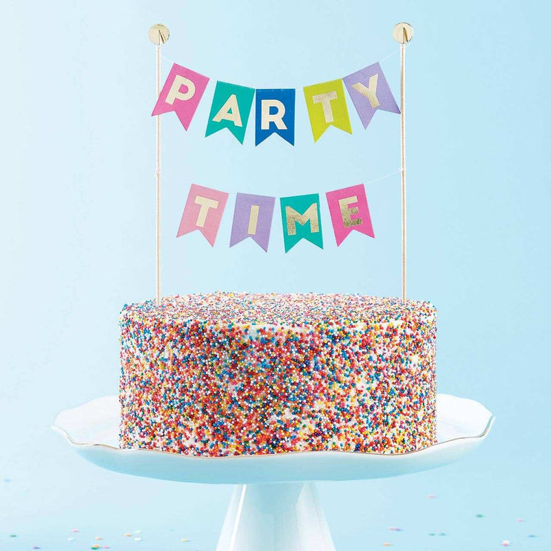 Garland Cake Topper on colorful sprinkle cake.